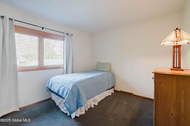 bedroom with visible vents, carpet flooring, and baseboards