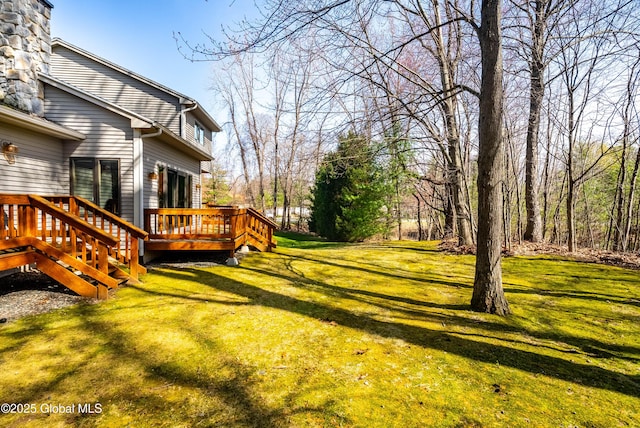 view of yard featuring a deck
