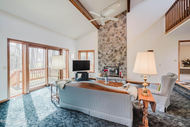 living room with ceiling fan, beam ceiling, a healthy amount of sunlight, and high vaulted ceiling