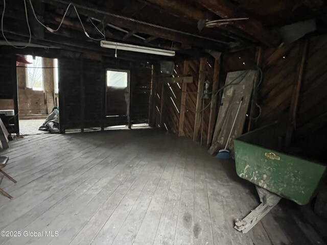 below grade area with hardwood / wood-style floors