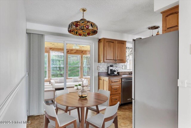 dining room featuring a textured ceiling