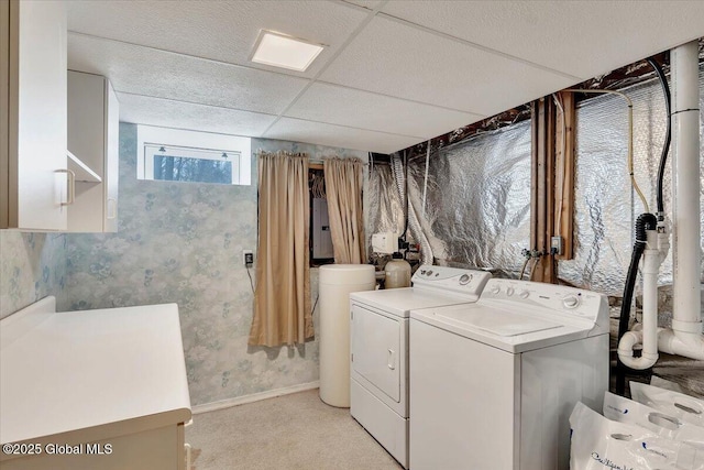 laundry room with washer and dryer, laundry area, light colored carpet, wallpapered walls, and electric panel
