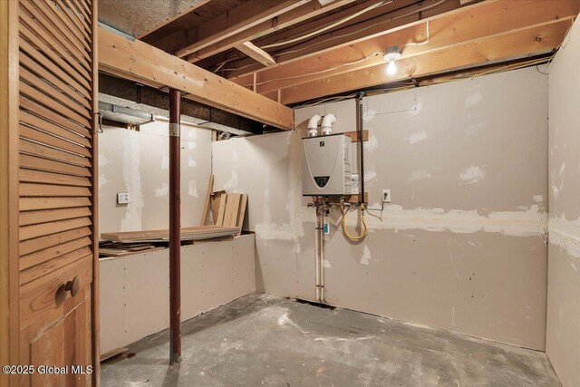 unfinished basement featuring water heater