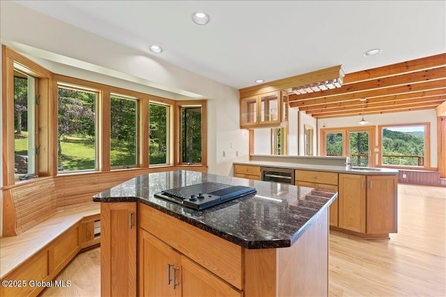 165 Vaughn Hill Rd, Middleburgh, NY 12122 - kitchen with wine cooler, gas cooktop, a center island, a peninsula, and dark stone countertops