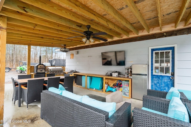view of patio / terrace with outdoor dining space, a ceiling fan, area for grilling, and an outdoor hangout area