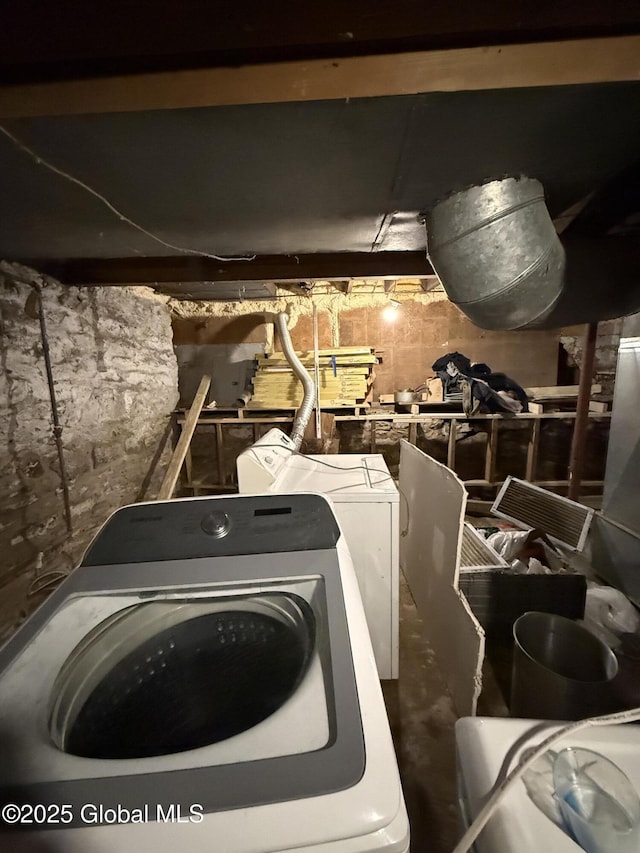 46 Slater St, Amsterdam, NY 12010 - unfinished below grade area featuring washer and dryer and concrete block wall