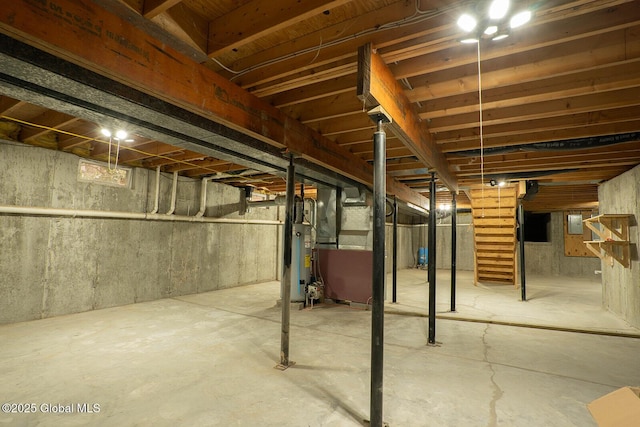 unfinished basement featuring water heater