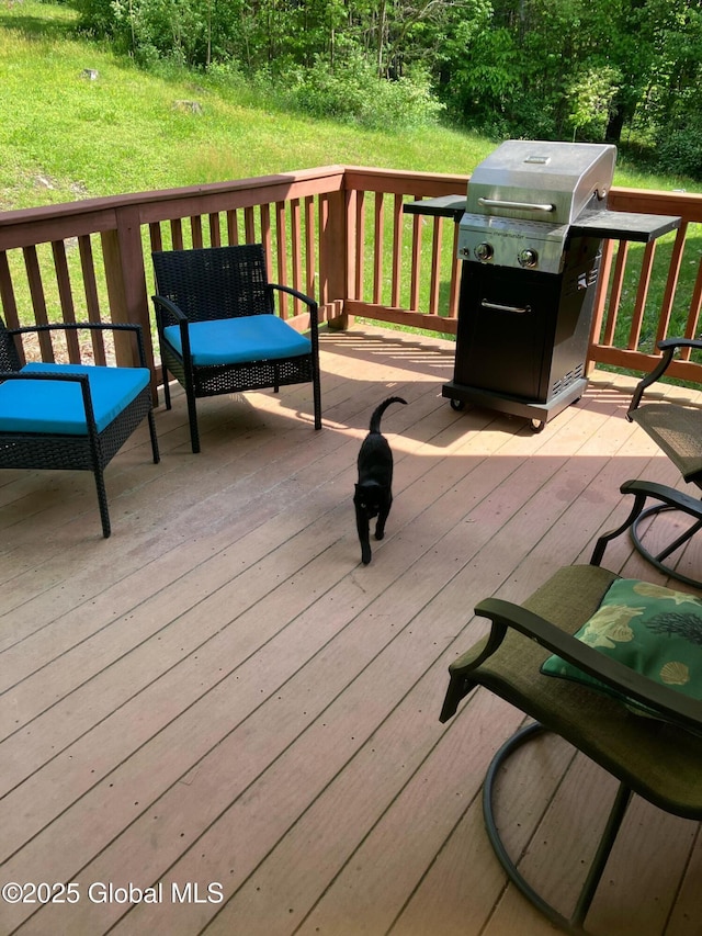 wooden terrace featuring grilling area