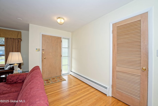 31 Tryon Ct, Albany, NY 12203 - living area with light wood-style flooring and baseboard heating