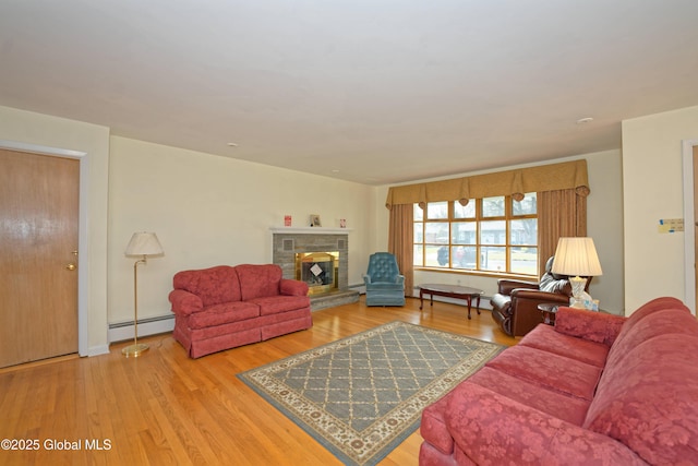 31 Tryon Ct, Albany, NY 12203 - living room featuring a baseboard heating unit, a glass covered fireplace, and wood finished floors