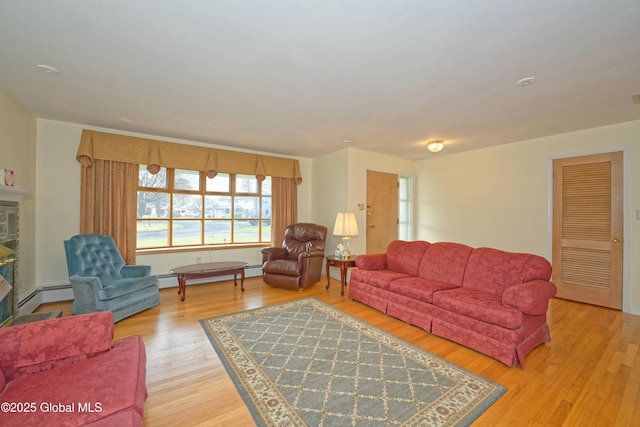 31 Tryon Ct, Albany, NY 12203 - living area featuring baseboard heating, a glass covered fireplace, and light wood-style floors