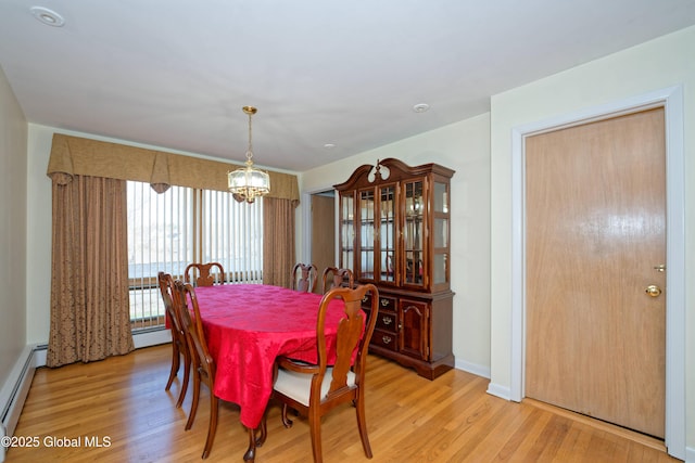 31 Tryon Ct, Albany, NY 12203 - dining area featuring baseboards, an inviting chandelier, light wood-style floors, and a baseboard radiator