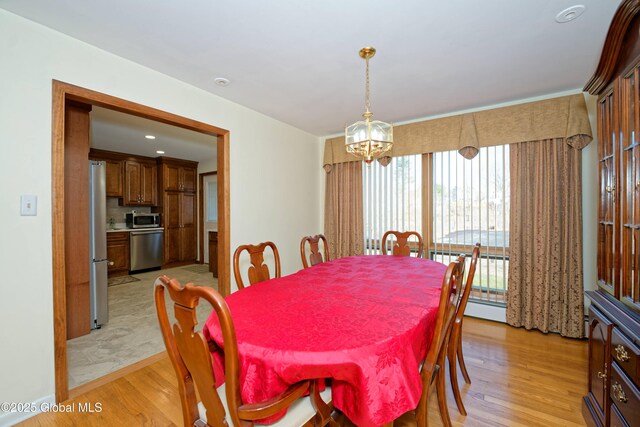 31 Tryon Ct, Albany, NY 12203 - dining room featuring a chandelier and light wood finished floors