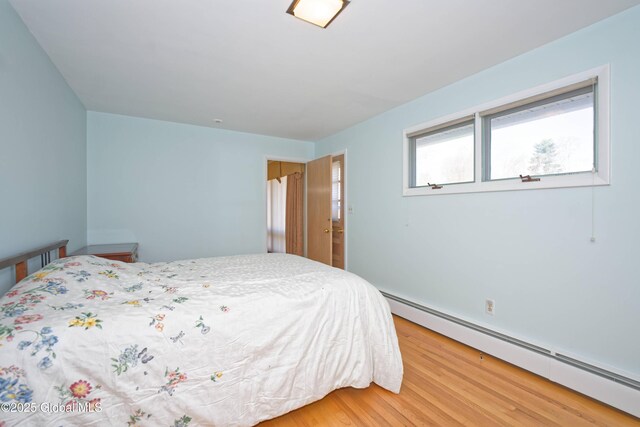 31 Tryon Ct, Albany, NY 12203 - bedroom with baseboard heating and light wood finished floors