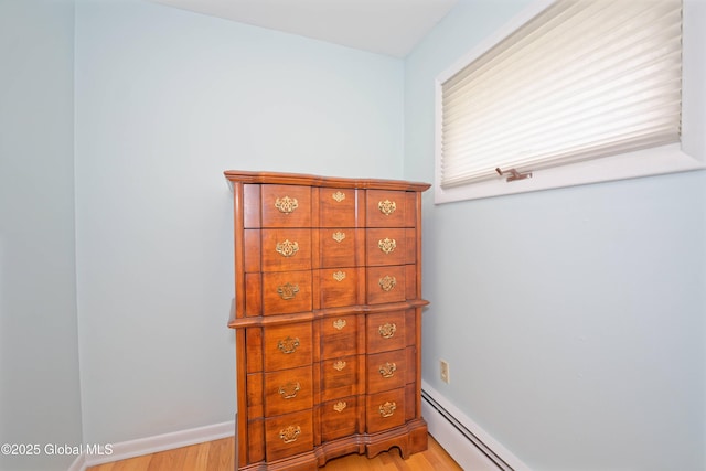 31 Tryon Ct, Albany, NY 12203 - interior space featuring a baseboard radiator, baseboards, and light wood finished floors