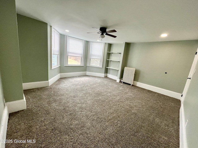 interior space featuring radiator heating unit, carpet flooring, and baseboards
