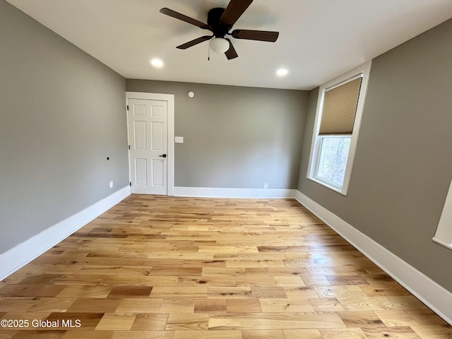 spare room with recessed lighting, ceiling fan, light wood-type flooring, and baseboards