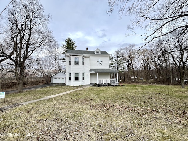exterior space with a porch, a shingled roof, a lawn, and aphalt driveway