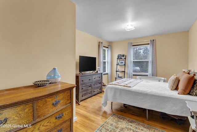 bedroom featuring light wood finished floors