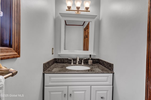 bathroom featuring an inviting chandelier and vanity