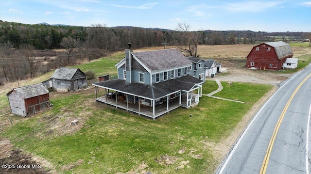 birds eye view of property with a rural view and a view of trees