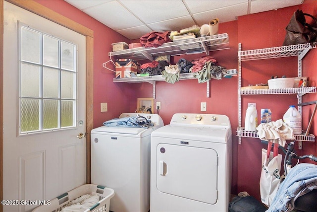 clothes washing area featuring independent washer and dryer and laundry area