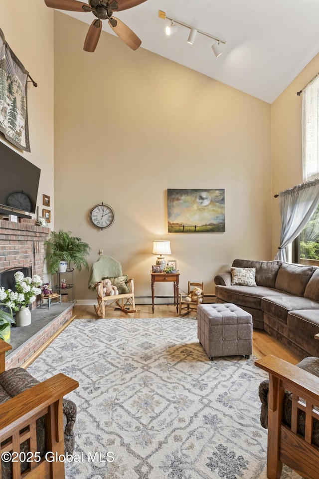66 Schaeffer Rd, Berlin, NY 12138 - living area with high vaulted ceiling, ceiling fan, track lighting, and a brick fireplace