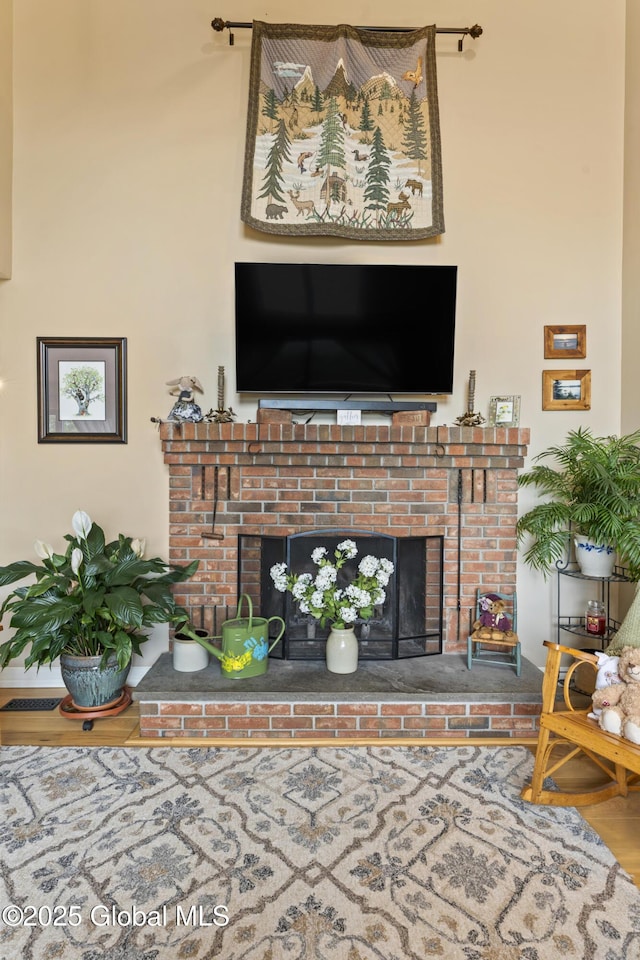 66 Schaeffer Rd, Berlin, NY 12138 - living area featuring a brick fireplace and wood finished floors