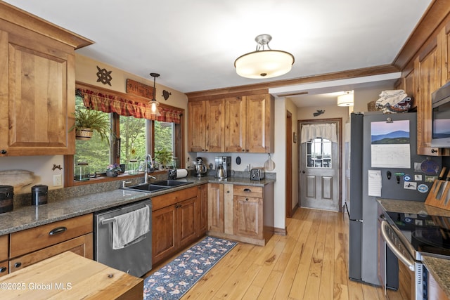 66 Schaeffer Rd, Berlin, NY 12138 - kitchen with stainless steel appliances, brown cabinets, and dark stone counters