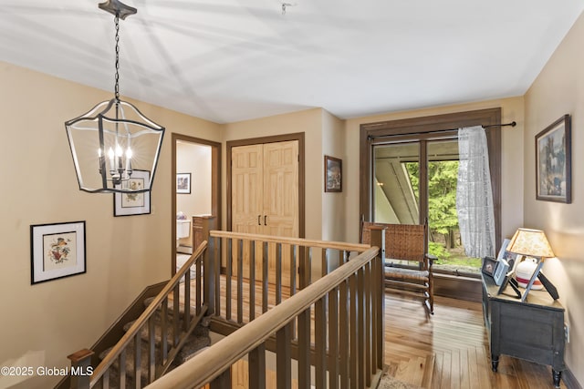 66 Schaeffer Rd, Berlin, NY 12138 - hall with an upstairs landing, a chandelier, and wood finished floors