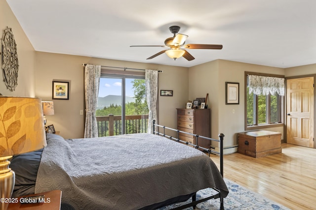66 Schaeffer Rd, Berlin, NY 12138 - bedroom with access to outside, multiple windows, wood finished floors, and ceiling fan