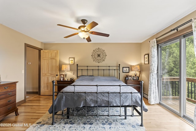 66 Schaeffer Rd, Berlin, NY 12138 - bedroom featuring light wood-style flooring, access to exterior, ceiling fan, and a baseboard radiator