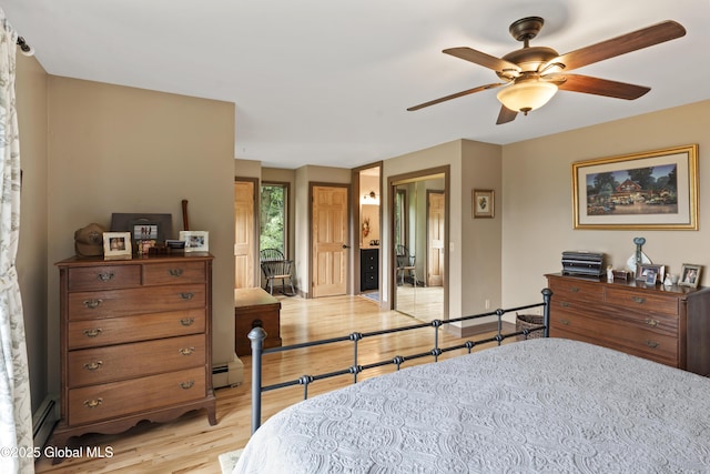 66 Schaeffer Rd, Berlin, NY 12138 - bedroom with light wood finished floors, a baseboard radiator, and ceiling fan