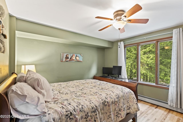 66 Schaeffer Rd, Berlin, NY 12138 - bedroom with a baseboard radiator, wood finished floors, and ceiling fan