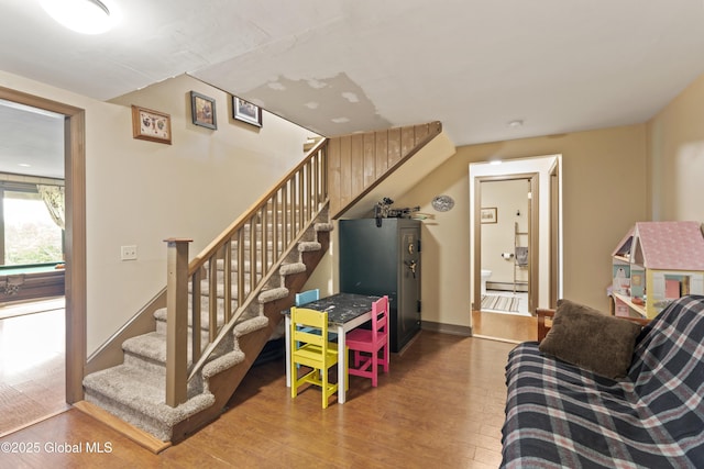 66 Schaeffer Rd, Berlin, NY 12138 - living area featuring wood finished floors, stairs, and baseboard heating