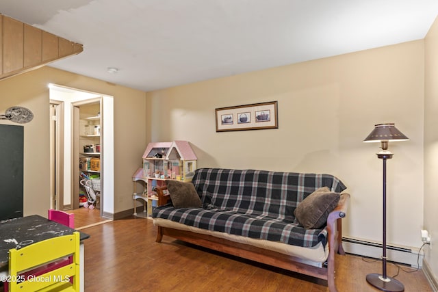 66 Schaeffer Rd, Berlin, NY 12138 - living room with a baseboard heating unit and wood finished floors