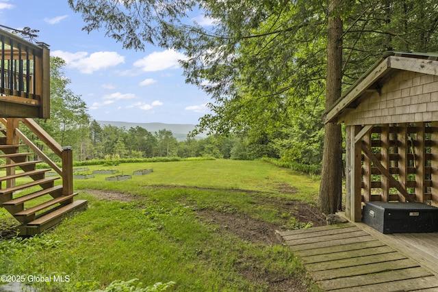 66 Schaeffer Rd, Berlin, NY 12138 - view of grassy yard featuring stairs and a wooded view