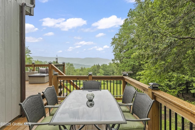 66 Schaeffer Rd, Berlin, NY 12138 - wooden deck with a mountain view and outdoor dining space