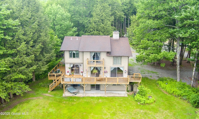 66 Schaeffer Rd, Berlin, NY 12138 - back of property with a balcony, a forest view, a patio area, stairs, and a yard