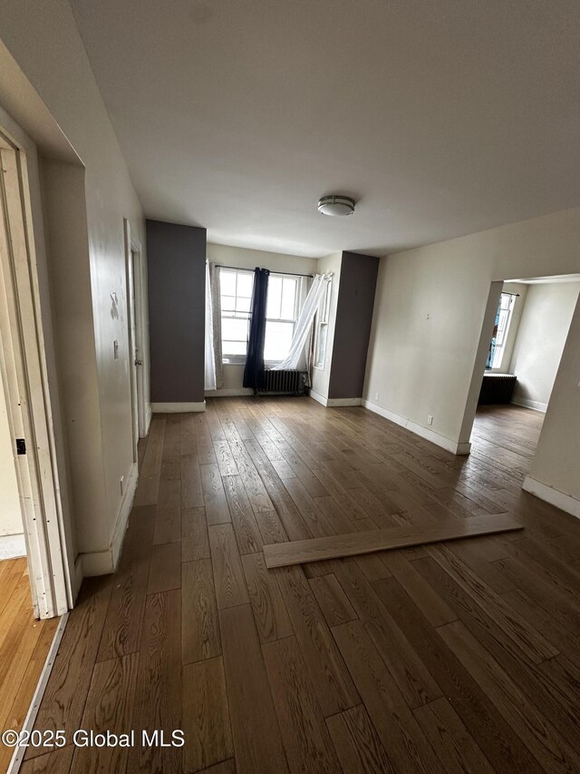 44 Storrie St, Amsterdam, NY 12010 - unfurnished room with dark wood finished floors and baseboards