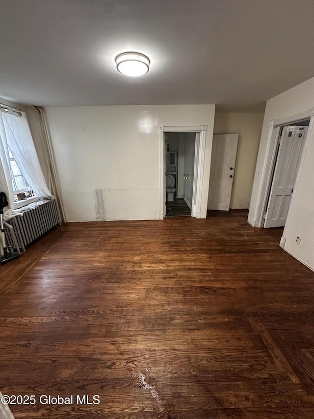 44 Storrie St, Amsterdam, NY 12010 - unfurnished room featuring radiator heating unit and dark wood-style flooring
