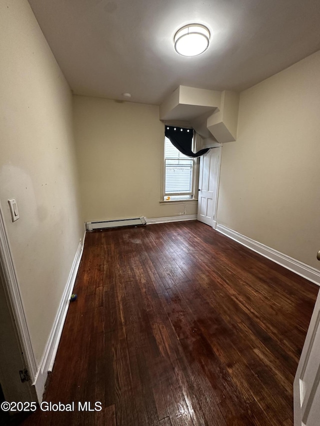 44 Storrie St, Amsterdam, NY 12010 - unfurnished dining area with dark wood-type flooring, baseboard heating, and baseboards