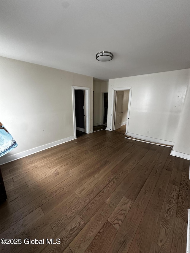 44 Storrie St, Amsterdam, NY 12010 - spare room with dark wood-type flooring and baseboards