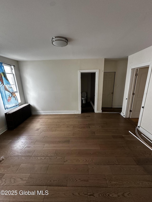 44 Storrie St, Amsterdam, NY 12010 - unfurnished room with radiator, hardwood / wood-style floors, and baseboards