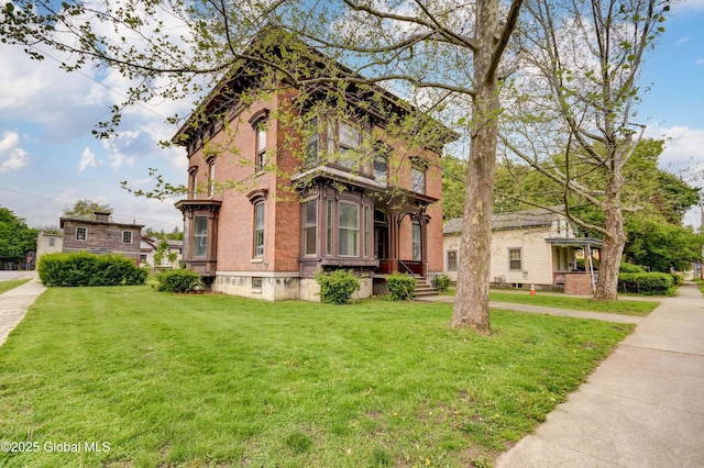 25 Willett St, Fort Plain, NY 13339 - view of front facade featuring a front lawn