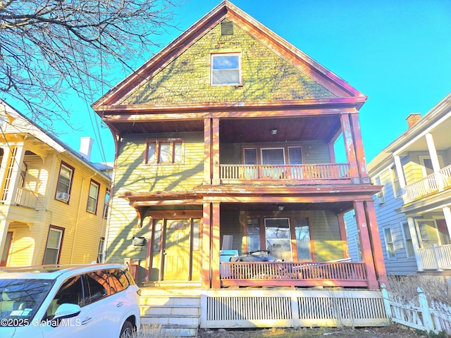 15 Kenyon Ct, Utica, NY 13501 - view of front of house featuring covered porch and a balcony