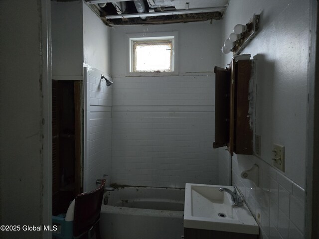 15 Kenyon Ct, Utica, NY 13501 - bathroom featuring tile walls, shower / bathing tub combination, and vanity