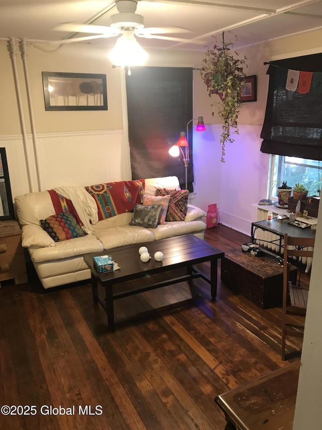 living room with a wainscoted wall, ceiling fan, and hardwood / wood-style floors