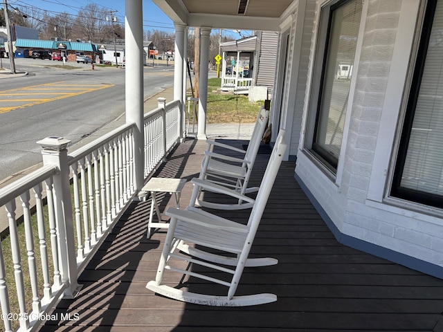 wooden terrace featuring a porch