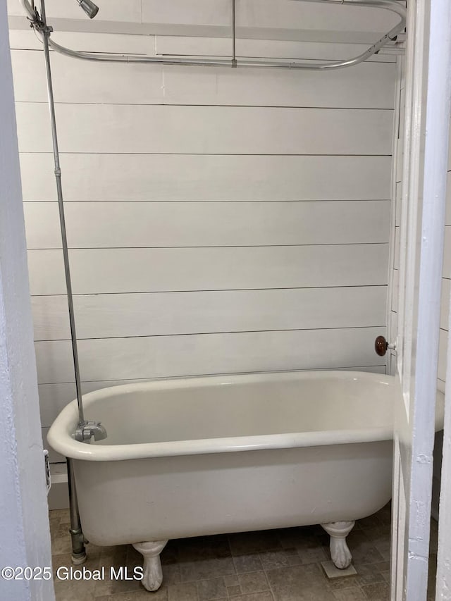 full bathroom with a washtub